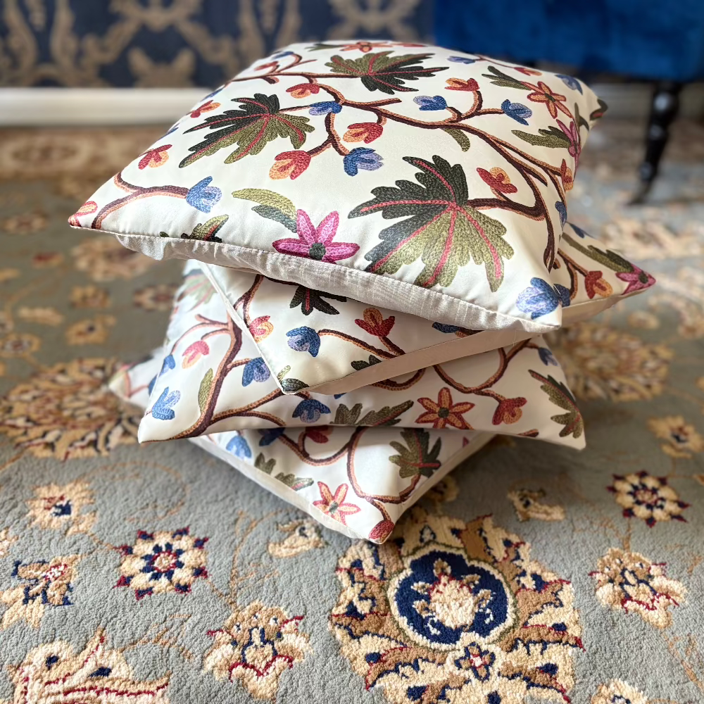 kashmir embroidery cushion cover on rug